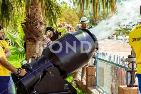 A stream of foam escapes from the foam generator. A foamy party on the beach Stock Photos