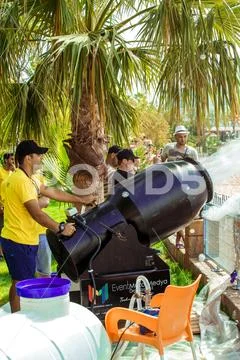 A stream of foam escapes from the foam generator. A foamy party on the beach Stock Photos