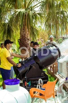 A stream of foam escapes from the foam generator. A foamy party on the beach Stock Photos