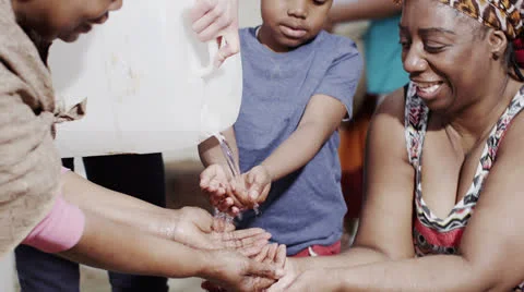 Stream of fresh water and the hands of people from a poor community Stock Footage 24910047