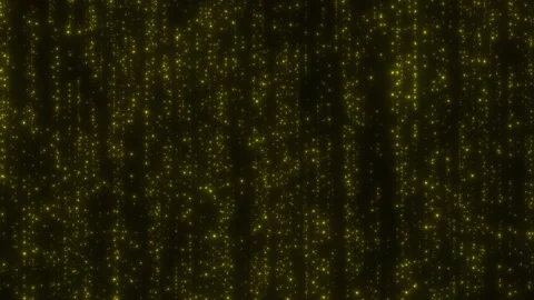 A stream of gold particles continuously flows from top to bottom against a black Stock Footage 154136062