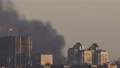 The stream of a heavy black smoke in the city 4k or 4k+ Resolution