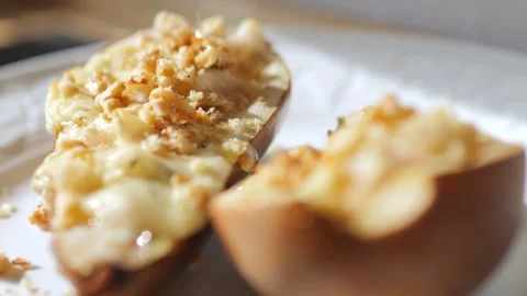 A stream of honey pours over a dessert of pears. Cooking concept. Fruit dessert. Stock Footage 270962150