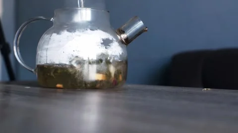 A stream of hot water is poured into the kettle, brewing. Morning breakfast Stock Footage 304160938