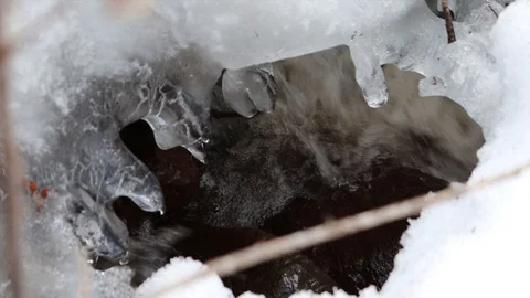 The stream melts snow in the spring Stock Footage 127711685