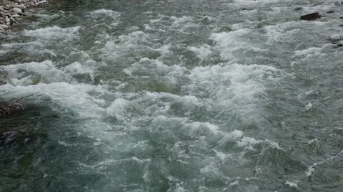 The stream of the mountain stream. Close-up on the water. Slow motion. Stock Footage 155153420
