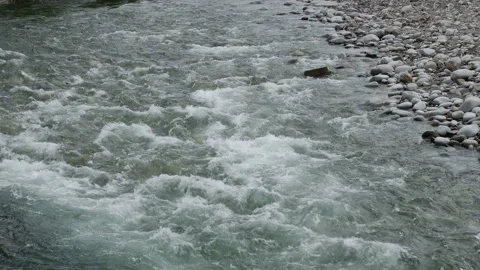 The stream of the mountain stream. Close-up on the water. Slow motion. Stock Footage 155153449