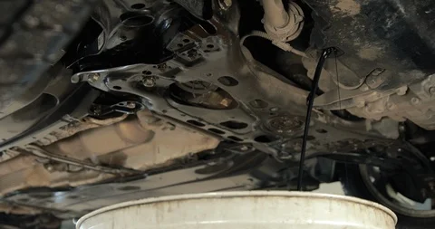 Stream Of The Old Used Engine Oil From A Car Stock-Footage 124958707