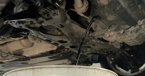 Stream Of The Old Used Engine Oil From A Car Stock-Footage 124960305