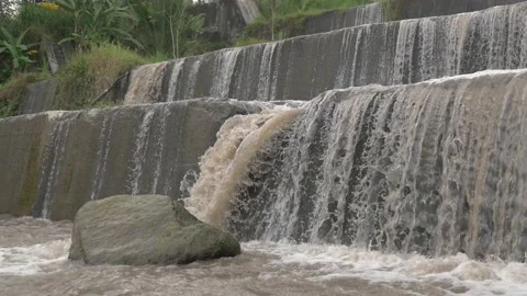 The stream that radiates forms a waterfall between the rocks Stock Footage 234945506