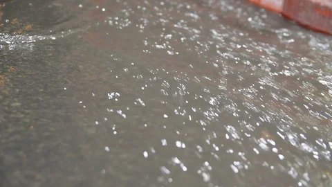 A stream of rainwater around the curb Video stock 105344243