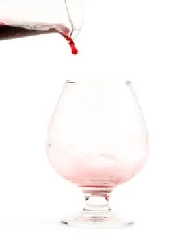 A stream of red wine Stock Photos