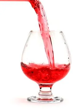 A stream of red wine Stock Photos