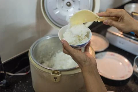 Stream rice in electric rice cooker Stock Photos