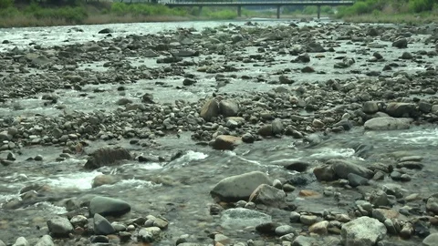 Stream in rocky riverbed  Stock Footage 108344389