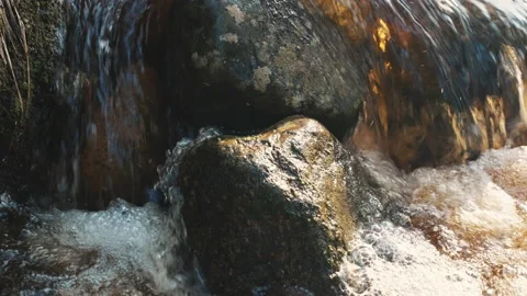Stream running fast in summer green forest. Small waterfall with crystal clear Stockbeeldmateriaal 197349107
