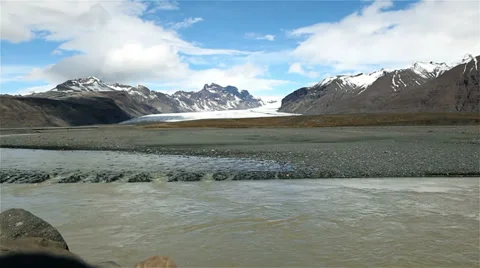 Stream running in front of glacier in Iceland Stock Footage 35127482