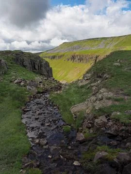 Stream running over High Cup Nick, Eden Valley, North Pennines, Cumbria Stock Photos