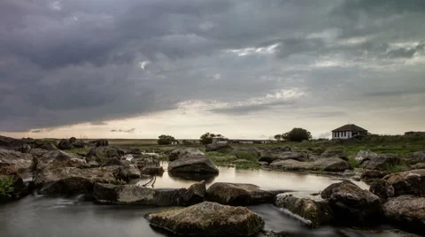 Stream running through the stones. Moving clouds Stock Footage 66526753