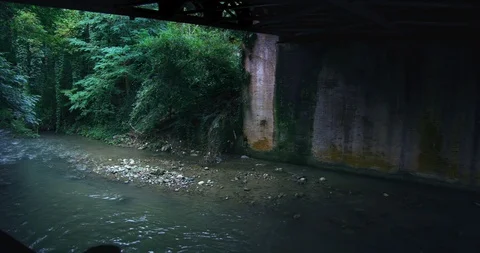 Stream running under an abandoned railway Stock Footage 118368078