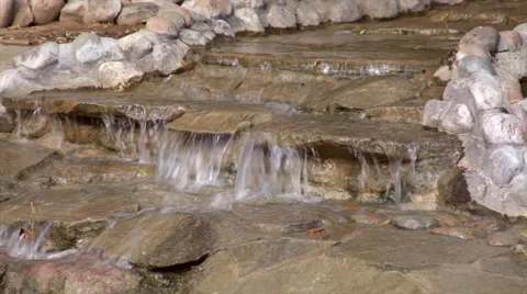Stream of running water over rocks. Видео 45009641