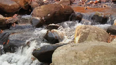 Stream runs over rocks Stock Footage 8984555