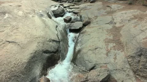 Stream Rushing Over Rock Stock Footage 12387939