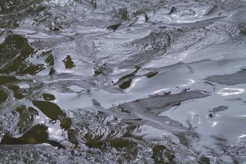 A stream of rushing water Stock Photos