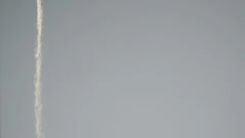 Stream of sand falling on gray background in super slow motion Stock Footage 88049900