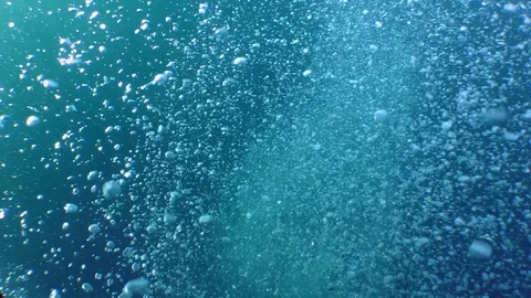 A stream of small air bubbles rising from the depths. Stock Footage 83736494