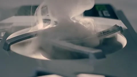 A stream of smoke is blown out of the video card fan. The video card overheated  Stock Footage 313145780