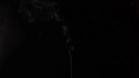 A stream of smoke from a cigarette on black background Stock Footage 126034414