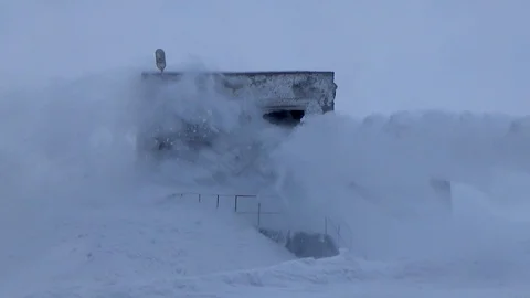 A stream of snow hits the building Video stock 114897755