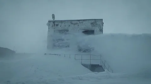 A stream of snow hits the house Stock Footage 127217695