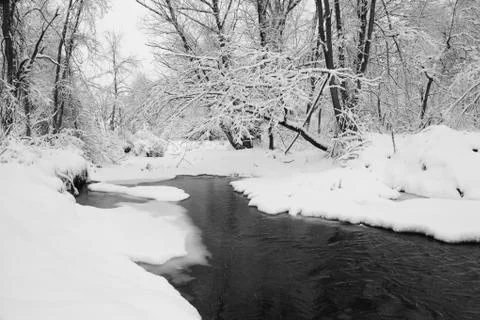 Stream in snow Stock Photos