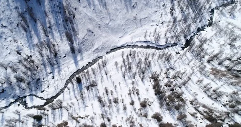 Stream in snowy valley Stock Footage 89195629