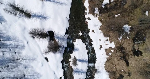 Stream in snowy valley Stock Footage 89196395