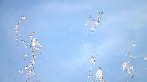 Stream spraying water drops. Drops of up and falling water from the fountain. 스톡 동영상 244389814