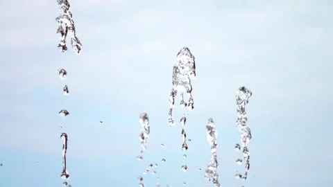 Stream spraying water drops. Drops of up and falling water from the fountain. 库存影片 244389830