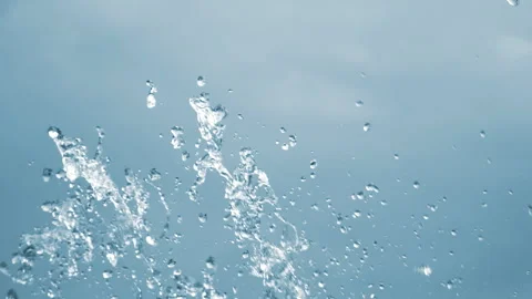 Stream spraying water drops. Drops of up and falling water from the fountain. Stock Footage 244389849