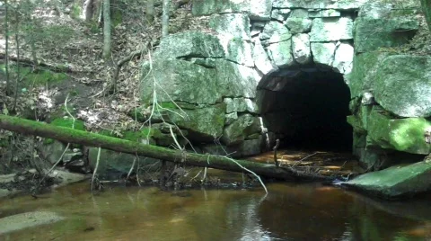 Stream stone tunnel Stock Footage 607016