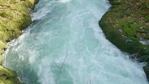 Stream swift bubbling in mountain river with stone shores Stock Footage 246851127