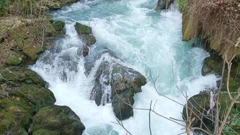 Stream swift bubbling in mountain river with stone shores 스톡 동영상 246851141