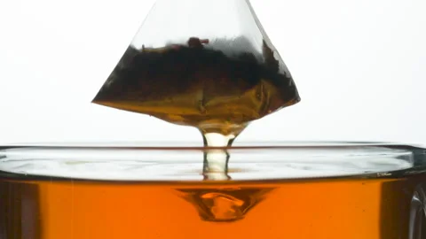 Stream of Tea Flows from the Tea Bag 4K Stock Footage 261305784
