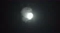 The stream of thick smoke against the background of bright light. Slow motion 4k or 4k+ Resolution
