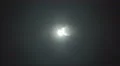 The stream of thick smoke against the background of bright light. Slow motion 4k or 4k+ Resolution
