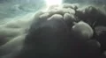 The stream of thick smoke on the background of dark surface. Slow motion capture 4k or 4k+ Resolution
