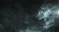 The stream of thick smoke on the background of dark surface. Slow motion capture 4k or 4k+ Resolution