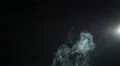 The stream of thick smoke on the background of dark surface. Slow motion capture 4k or 4k+ Resolution