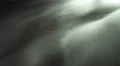 The stream of thick smoke on the background of dark surface. Slow motion capture 4k or 4k+ Resolution